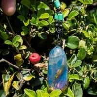 blue_amber_pendant_with_inclusions